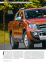 Der orangefarbene Pickup zieht Blicke auf sich